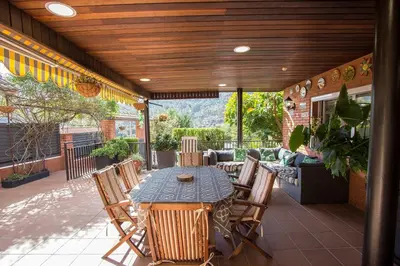 an outdoor patio with a table and chairs at Catalunya Casas Mountain escape with amazing views just 25km to BCN! in Torrelles de Llobregat