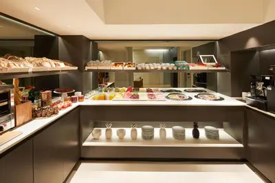 a bakery with a lot of food on display at Hotel Denit Barcelona in Barcelona