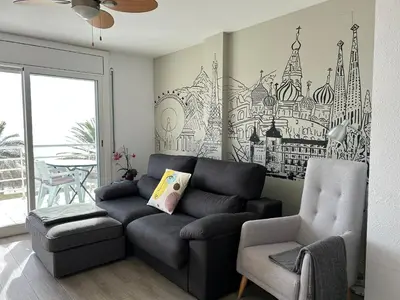a living room with a couch and a chair at Apartment Foix in Cubelles