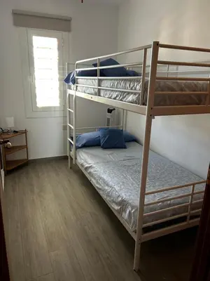 a bedroom with two bunk beds in a room at Apartment Foix in Cubelles