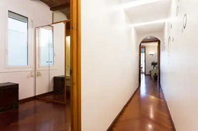 a hallway with a mirror on the wall at Casa Cosi Mallorca I in Barcelona