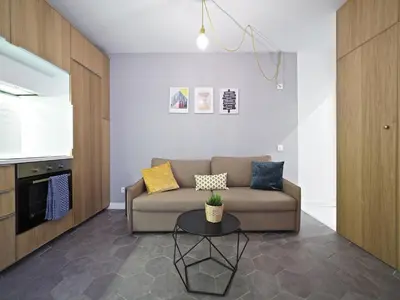 a living room with a couch and a table at Torrassa Cozy Apartment by Olala Homes in Hospitalet de Llobregat