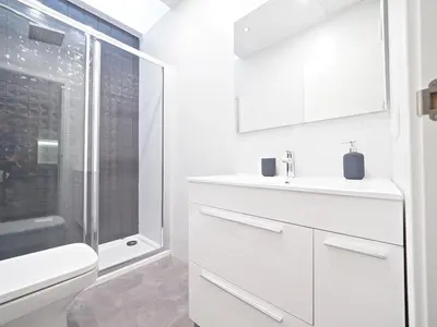 a bathroom with a toilet and a sink and a shower at Torrassa Cozy Apartment by Olala Homes in Hospitalet de Llobregat