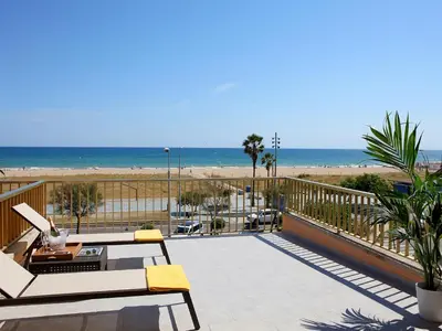 a balcony with a view of the beach at Aparthotel Solifemar in Castelldefels