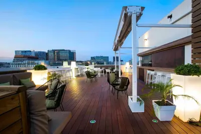 a large living room with a couch and chairs at Golden Hotel Barcelona in Barcelona