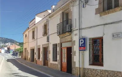 a street with a parking sign next to a building at Lovely Apartment In Pineda De Mar in Pineda de Mar