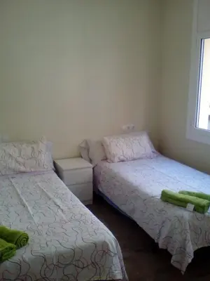a kitchen with a table and chairs in a room at Castel Apartments in Hospitalet de Llobregat