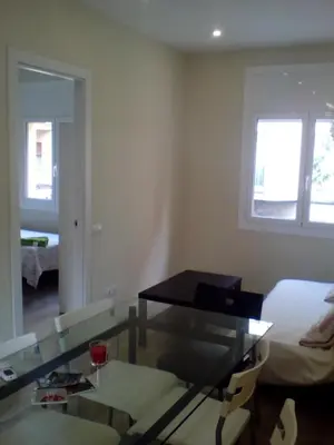 a living room with a couch and a table at Castel Apartments in Hospitalet de Llobregat