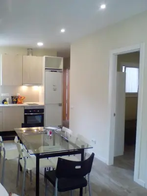 a room with a bed and a table in a room at Castel Apartments in Hospitalet de Llobregat