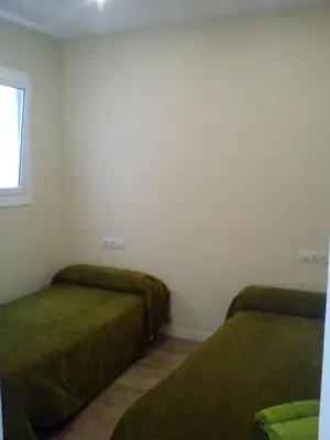 a small kitchen with a sink and a window at Castel Apartments in Hospitalet de Llobregat