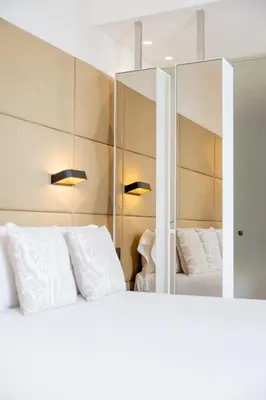 a bedroom with a bed and a tub and a sink at Hotel SB Glow 4 Sup in Barcelona