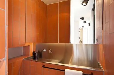 a bathroom with a sink and a mirror at DestinationBCN Urgell Apartment in Barcelona