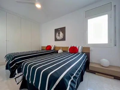 two beds sitting next to each other in a bedroom at Vivalidays Yolanda in Calella
