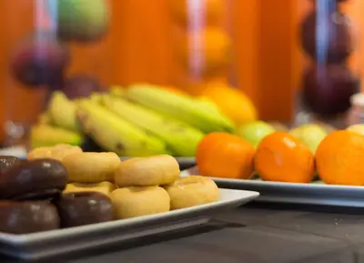two plates of fruit on top of a table at Hotel Venture Sant Cugat in Sant Cugat del Vallès