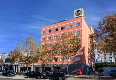 a building with a clock tower on top of it at B&B HOTEL Barcelona Rubí in Rubí