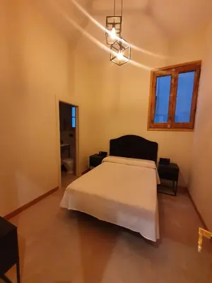 a bedroom with a large bed in a room at Hostal Lausanne in Barcelona