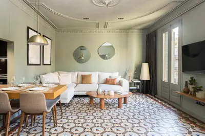 a living room with a white couch and a table at Unique Rentals - Luxurious Oasis in Barcelona