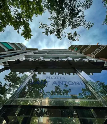 a glass building with the sign for a hotel entrance at SM Hotel Sant Antoni in Barcelona