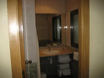 a bathroom with a sink and a mirror at Hostal Nuevo Colon in Barcelona