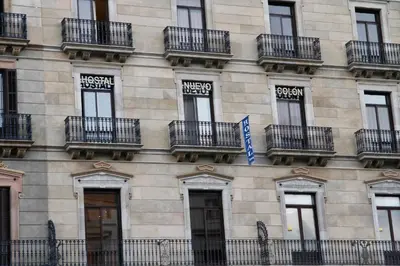 a building with balconies on the side of it at Hostal Nuevo Colon in Barcelona