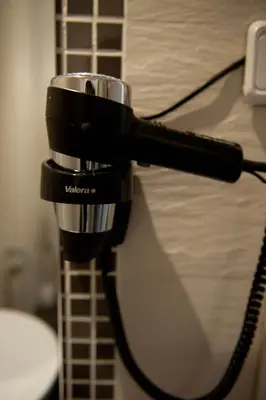 a black coffee maker sitting on top of a table at Hostal Bcn 46 in Barcelona
