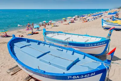 a group of boats sitting on a beach at Hotel Sorrabona in Pineda de Mar