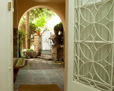 an entry door to a house with a gate at Tibidabo Apartments in Barcelona