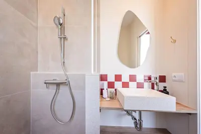 a bathroom with a sink and a mirror at Sweett - Wellington in Barcelona