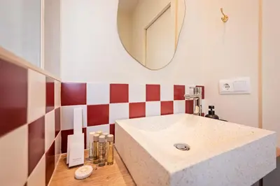 a bathroom with a sink and a mirror at Sweett - Wellington in Barcelona