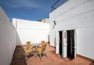 a balcony with a table and chairs on a patio at Cuatro Naciones in Barcelona