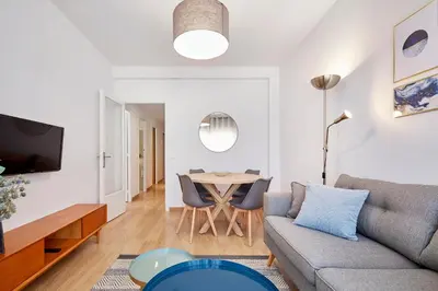 a living room with a couch and a table at Fisa Rentals Aribau in Barcelona