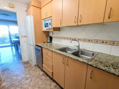 a living room with a couch and a table at Spacious apartment in Cabrera de Mar with sea view in Cabrera de Mar