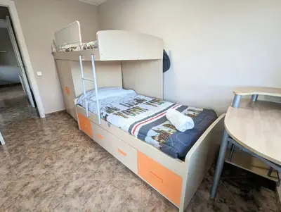 a small kitchen with a sink and a microwave at Spacious apartment in Cabrera de Mar with sea view in Cabrera de Mar