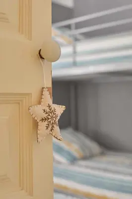 a star decoration on a door of a bedroom at Cal Mateu 11 huéspedes - Sagrada Família in Barcelona