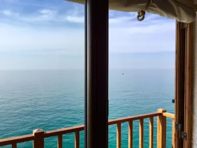 a view of the ocean from a window at The Magic Sea Front by Hello Homes Sitges in Sitges