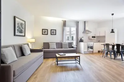a living room with a couch and a table at Amister Apartments in Barcelona