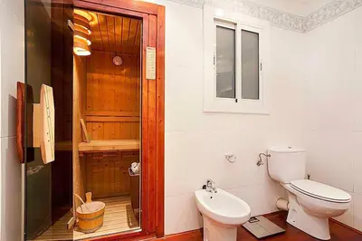 a bathroom with a toilet and a shower in it at Gracia Apartment in Barcelona