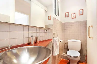 a bathroom with a sink and a toilet at Gracia Apartment in Barcelona