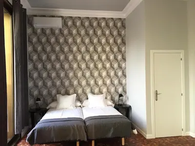a bedroom with a bed with a wall at Hip Karma Hostel in Barcelona