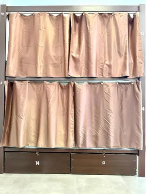 a curtain is on top of a dresser at Hip Karma Hostel in Barcelona