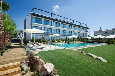 a hotel with a swimming pool and a resort at Hotel Boutique dONNA in Castelldefels