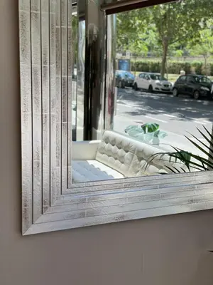 a window with a couch in front of a building at SM Hotel Teatre Auditori in Barcelona