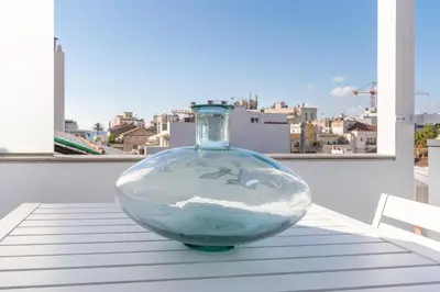 a glass vase sitting on top of a table at Beach penthouse Sitges Rentals in Sitges