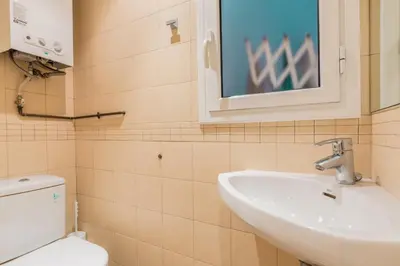 a bathroom with a sink and a toilet at ApartEasy - Sant Antoni Market in Barcelona