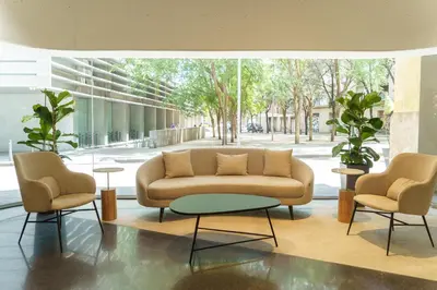a living room with a couch and two chairs at Casa Lit Barcelona in Barcelona