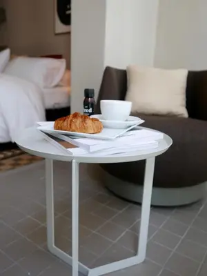 a white table with a plate of food on it at DestinationBCN - Universitat Rooms in Barcelona