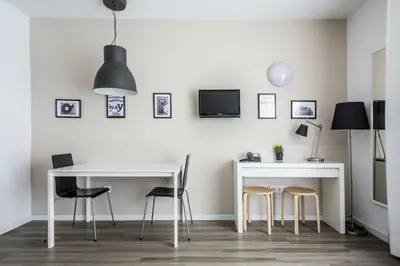 a dining room with a white table and chairs at Residencia Universitaria Resa Campus del Mar in Barcelona