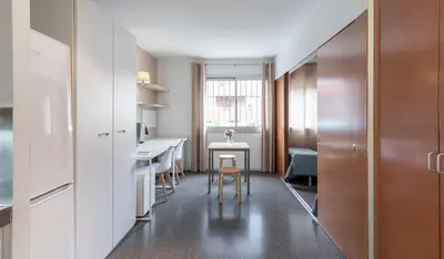 a small apartment with a kitchen and a dining room at Residencia Universitaria Resa Campus del Mar in Barcelona