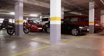 a parking garage with many cars parked in it at Great Sea-Side Barcelona Apartment in Badalona