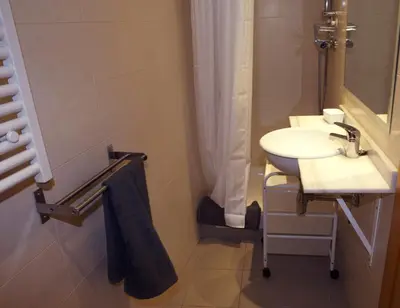 a bathroom with a sink and a shower curtain at Great Sea-Side Barcelona Apartment in Badalona